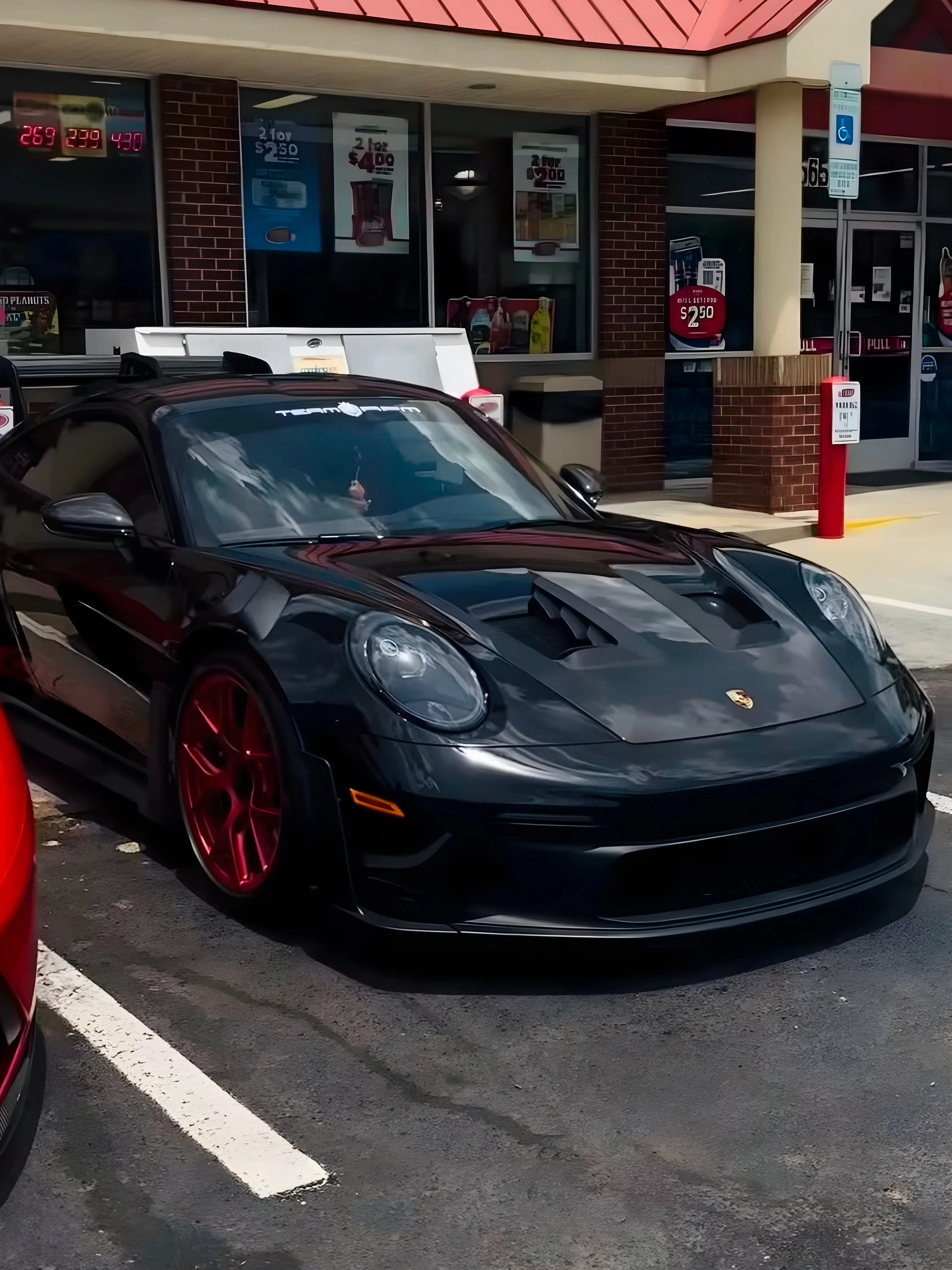 Black Porsche 911 GT3 RS with TEAM RPM banner at Supercars and Sushi meet