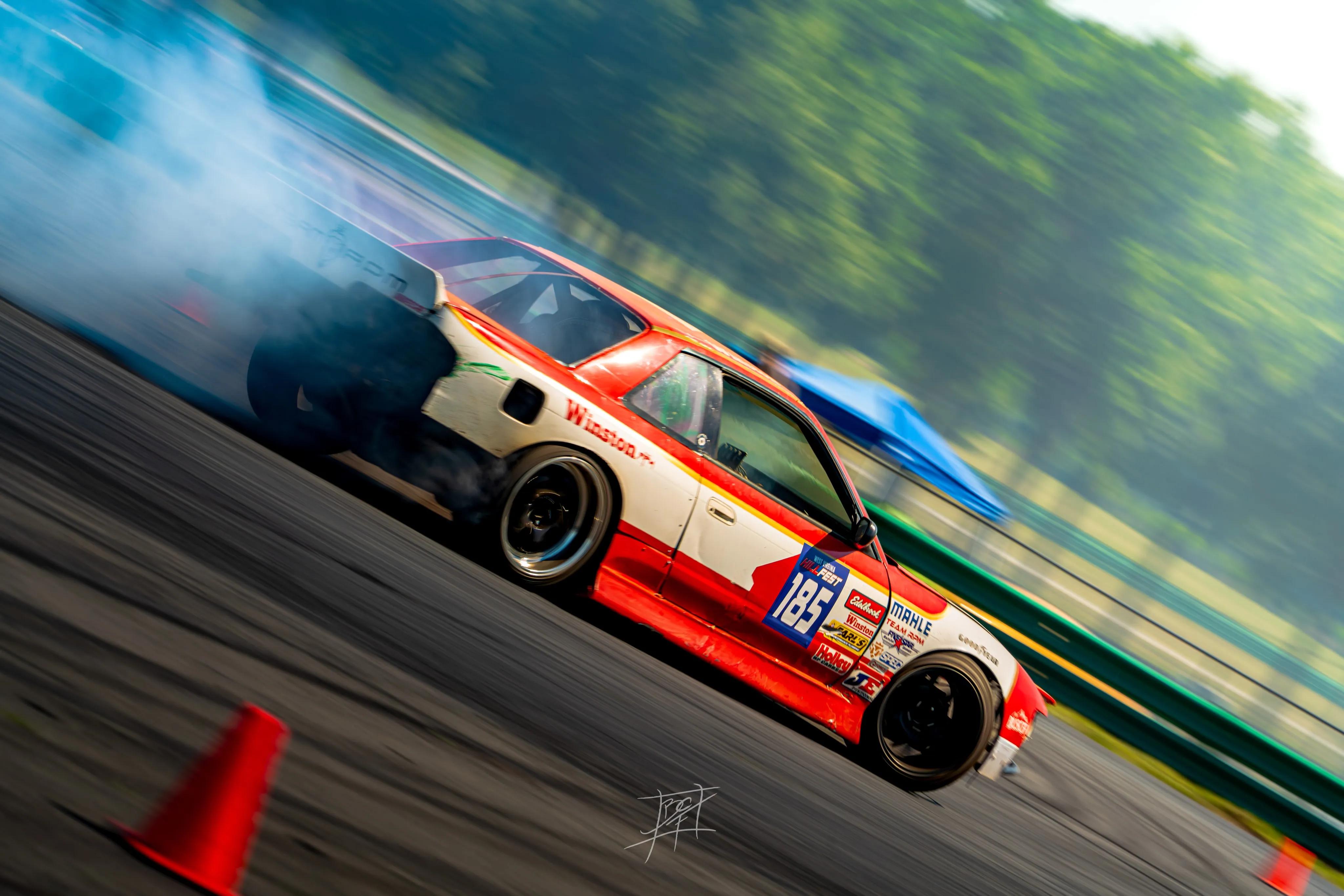 Winston-livery number 185 S-chassis mid-drift, heavy motion blur