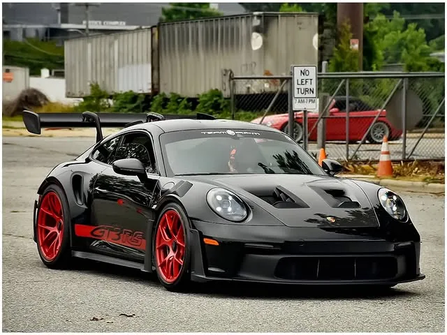 Black Porsche GT3 RS and red Lamborghini Aventador at Cars and Coffee Greensboro